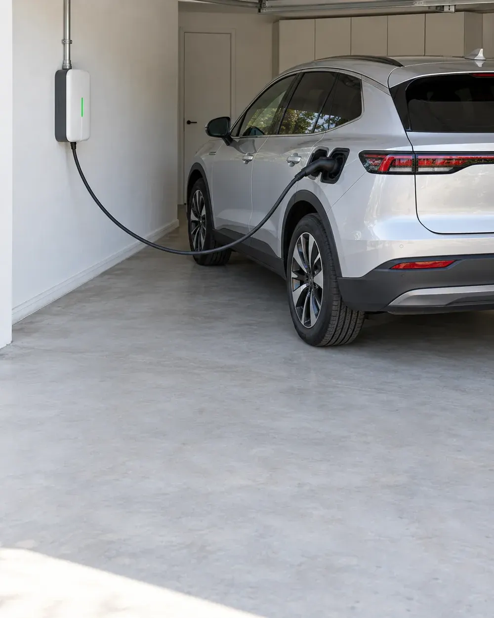 EV charger installation with solar in Los Angeles, CA: wall-mounted charger in a garage
