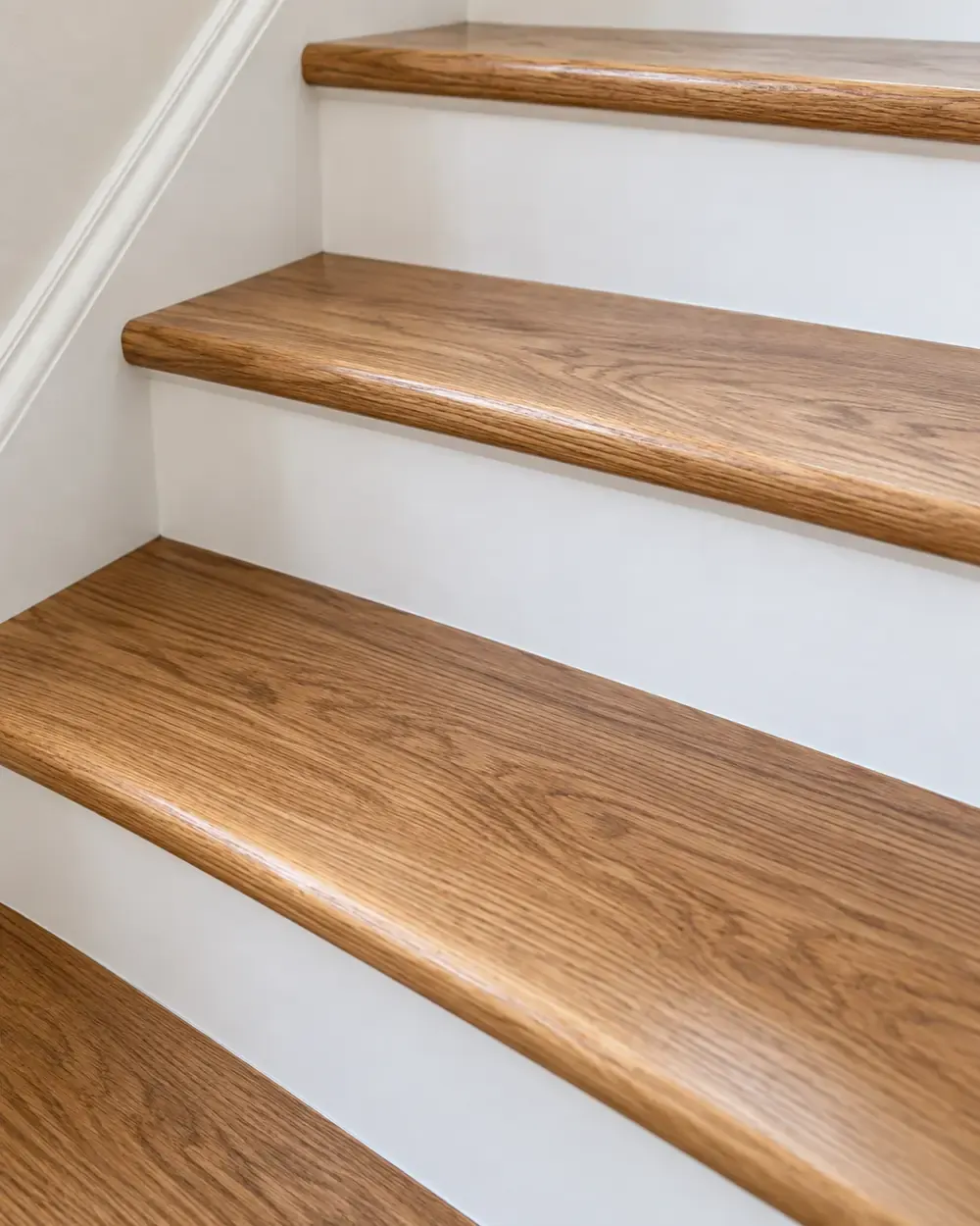 Stair flooring installation in Los Angeles: oak stair treads with white risers