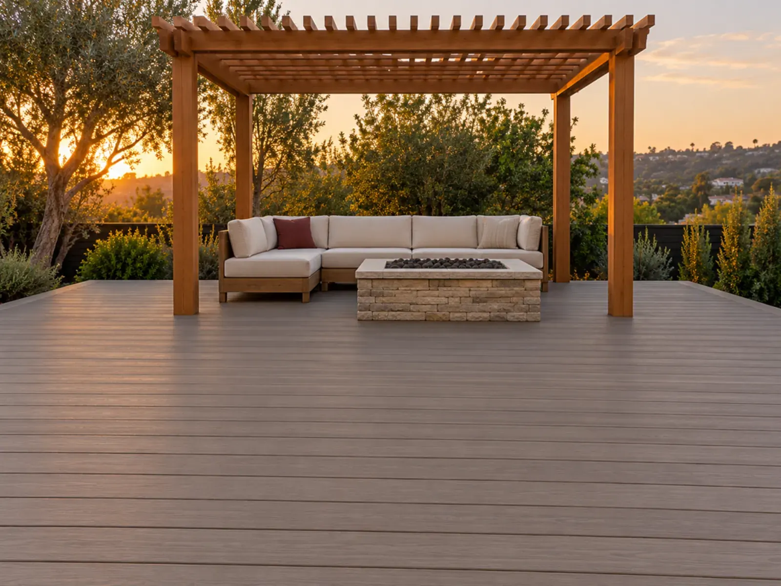 Deck and patio in Los Angeles: composite deck with a cedar pergola and fire pit at golden hour